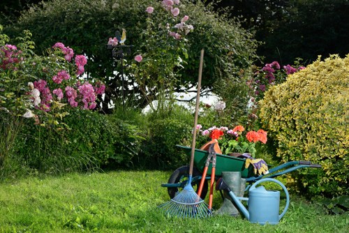 Team member handling garden materials with proper lifting technique
